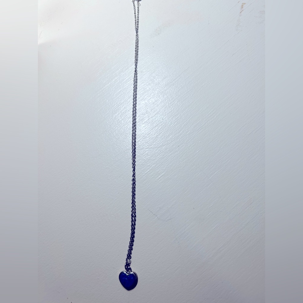 Womens silver 18” necklace with blue stone heart pendant. Gently used.